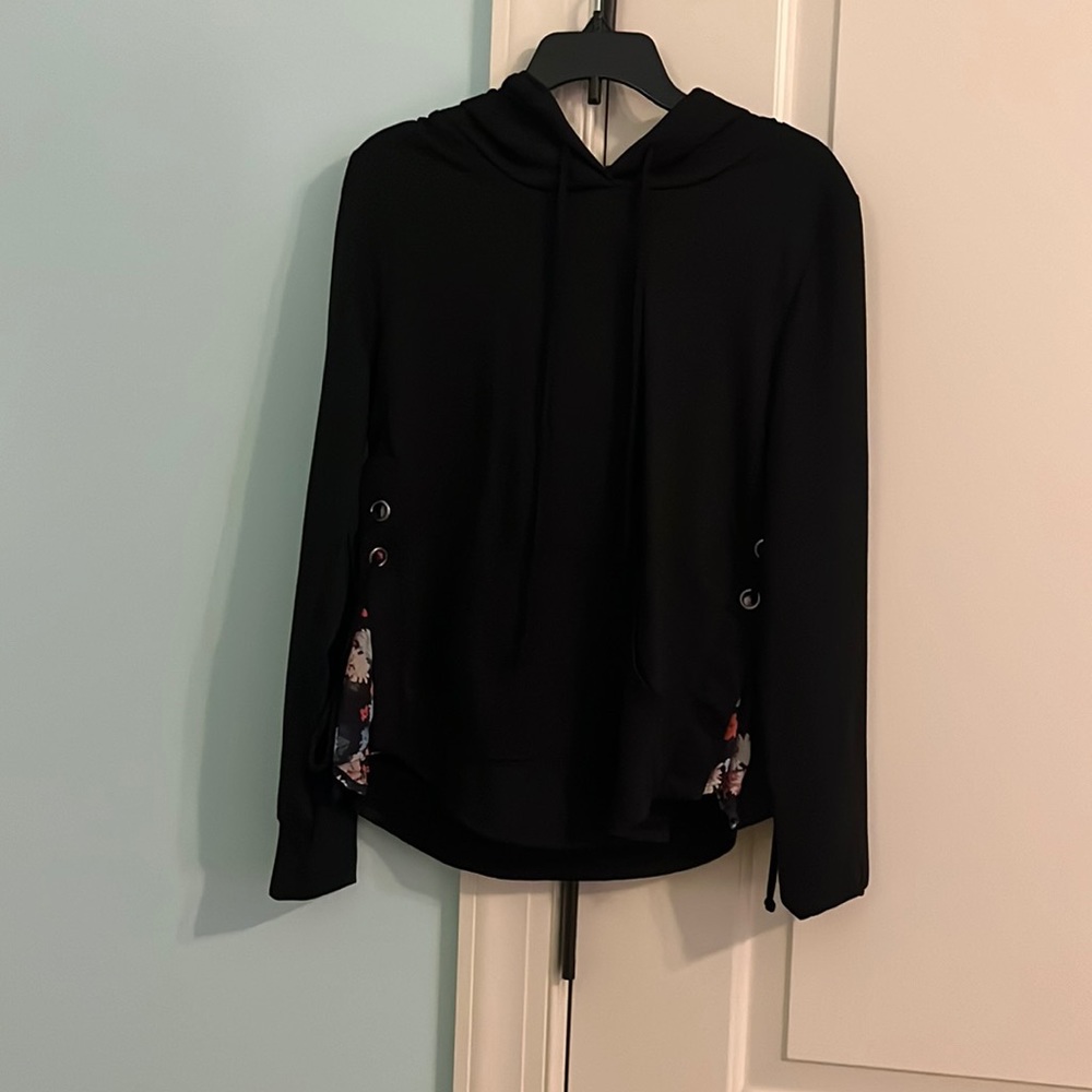 black hoodie with flower pattern on the side